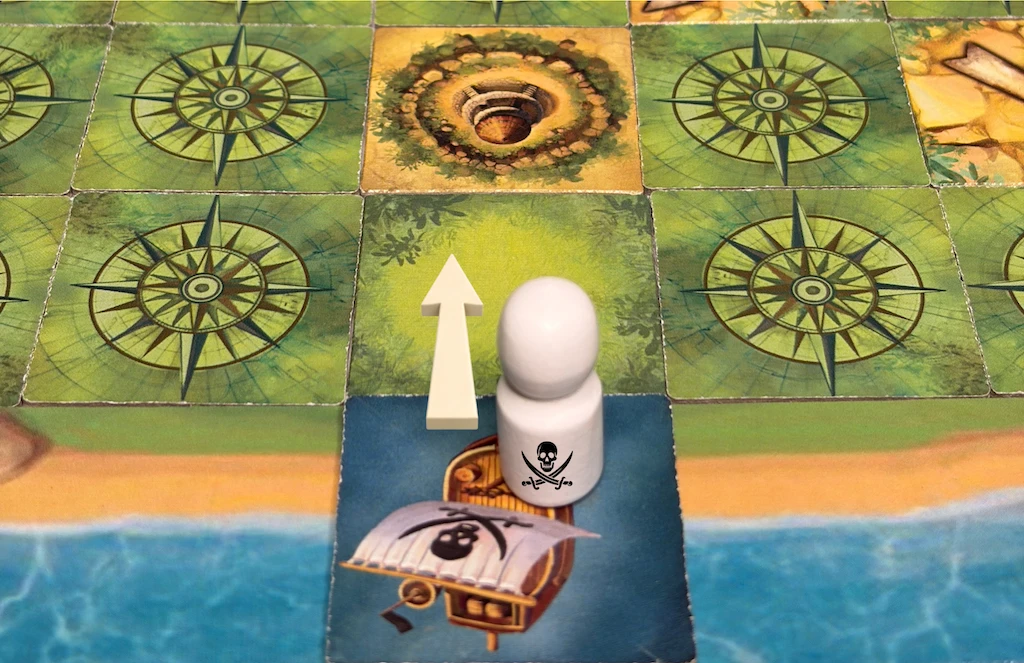 Terra Incognita game setup with ship and island tiles
